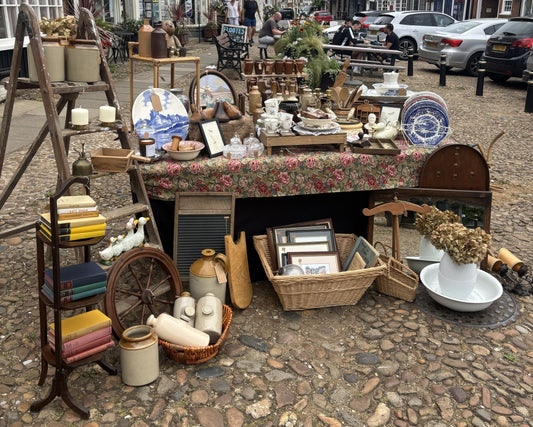 Vintage stoneware pots and glass trinkets displayed at The Burning Butterfly market stall