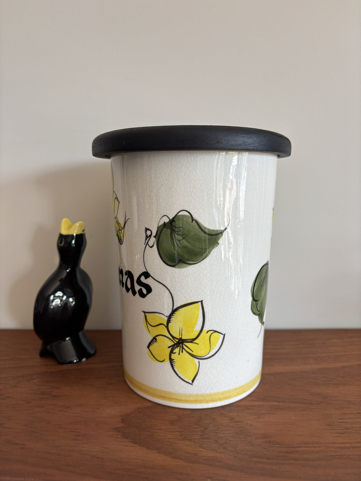A vintage Toni Raymond Ceramic Storage jar. Featuring yellow flowers and the words Sultanas in black lettering on the front.  