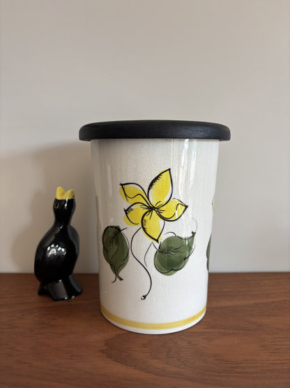 A vintage Toni Raymond Ceramic Storage jar. Featuring yellow flowers and the words Sultanas in black lettering on the front.  