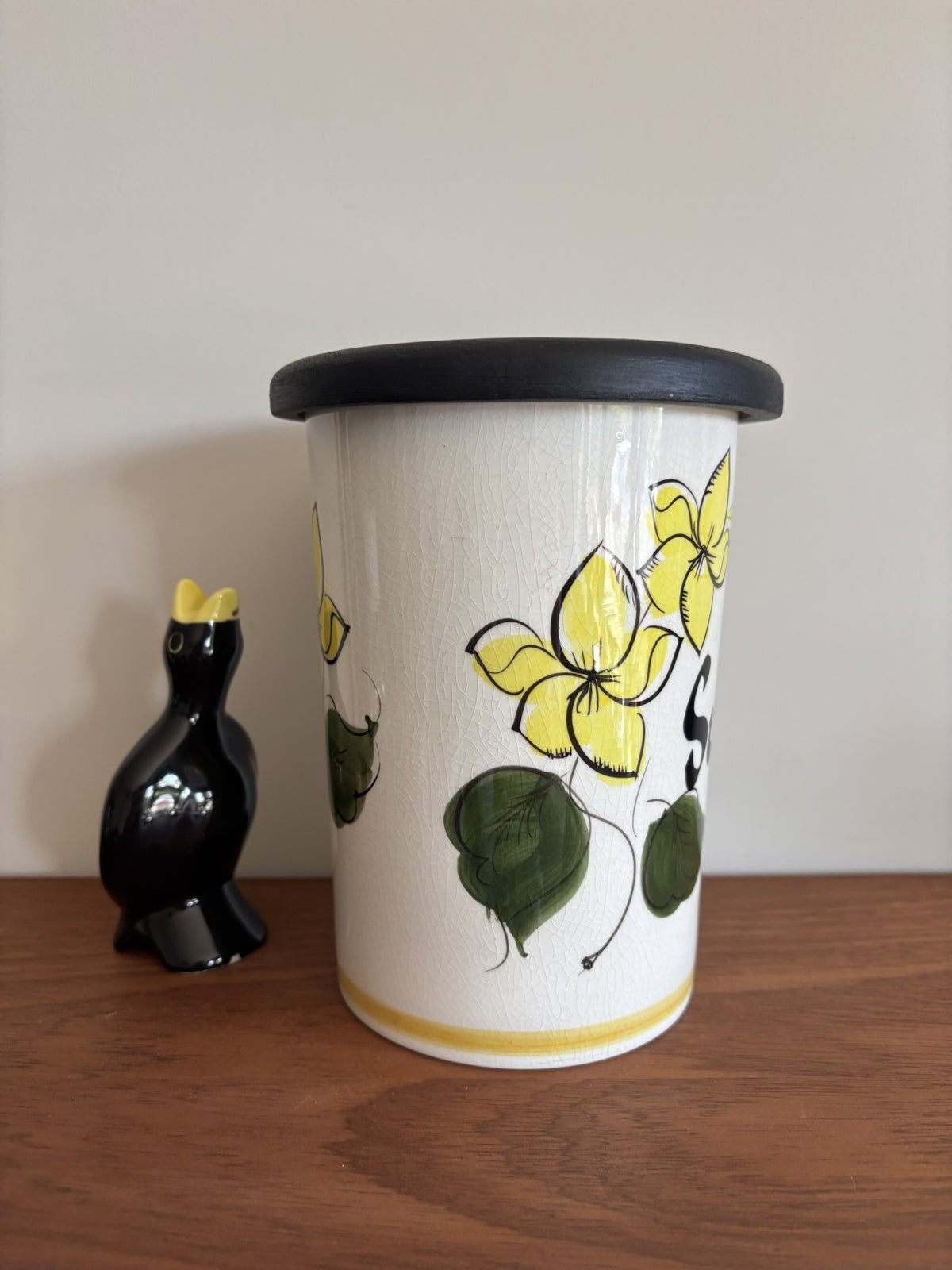 A vintage Toni Raymond Ceramic Storage jar. Featuring yellow flowers and the words Sultanas in black lettering on the front.  