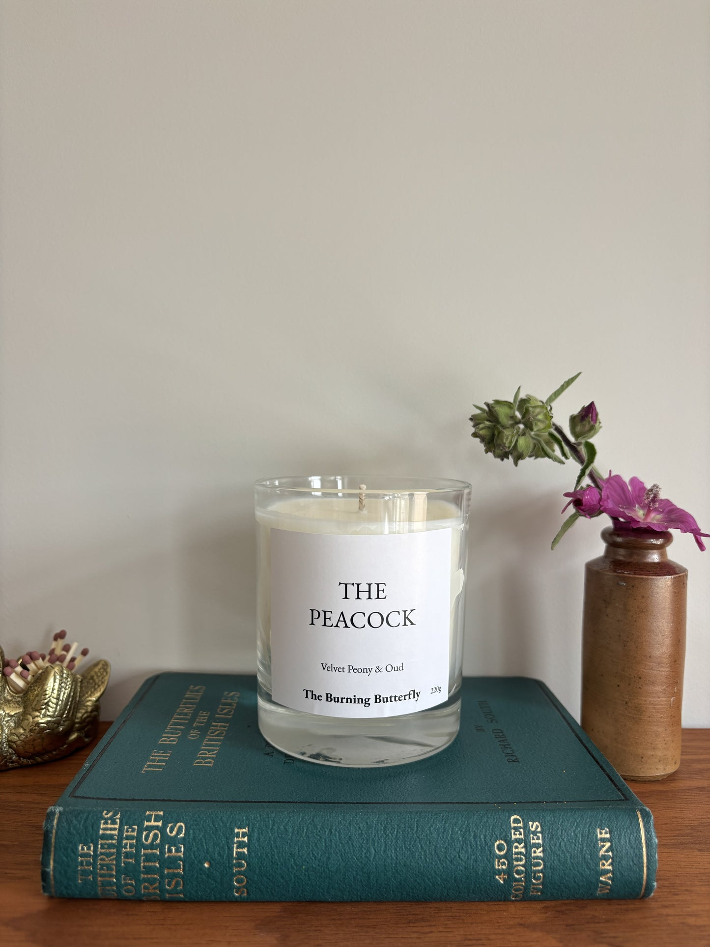 The Peacock Scented Candle in clear glass - Velvet Peony and Oud | The Burning Butterfly