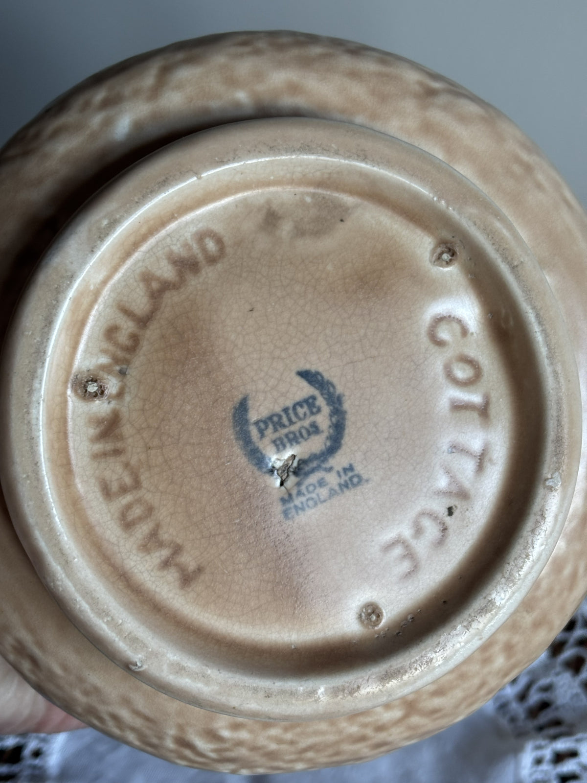 Close-up bottom view of a Vintage Price Bros jug with the words Made in England, Cottage and the Price Bros makers mark.  