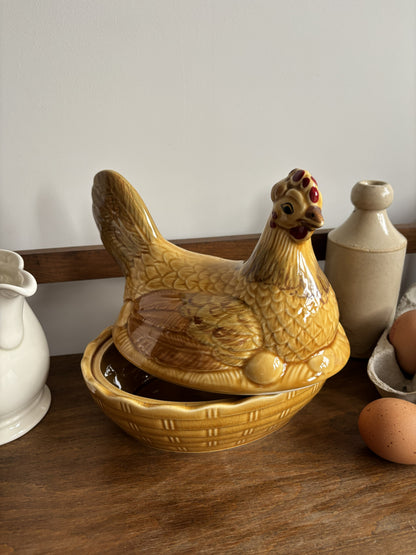 A honey yellow/brown glazed ceramic hen on nest egg keeper.  