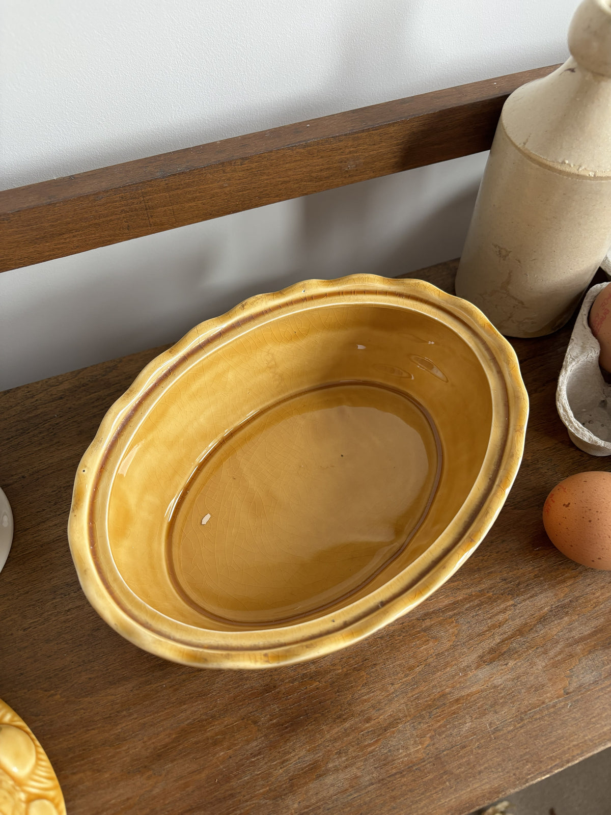 A honey yellow/brown glazed ceramic hen on nest egg keeper.  