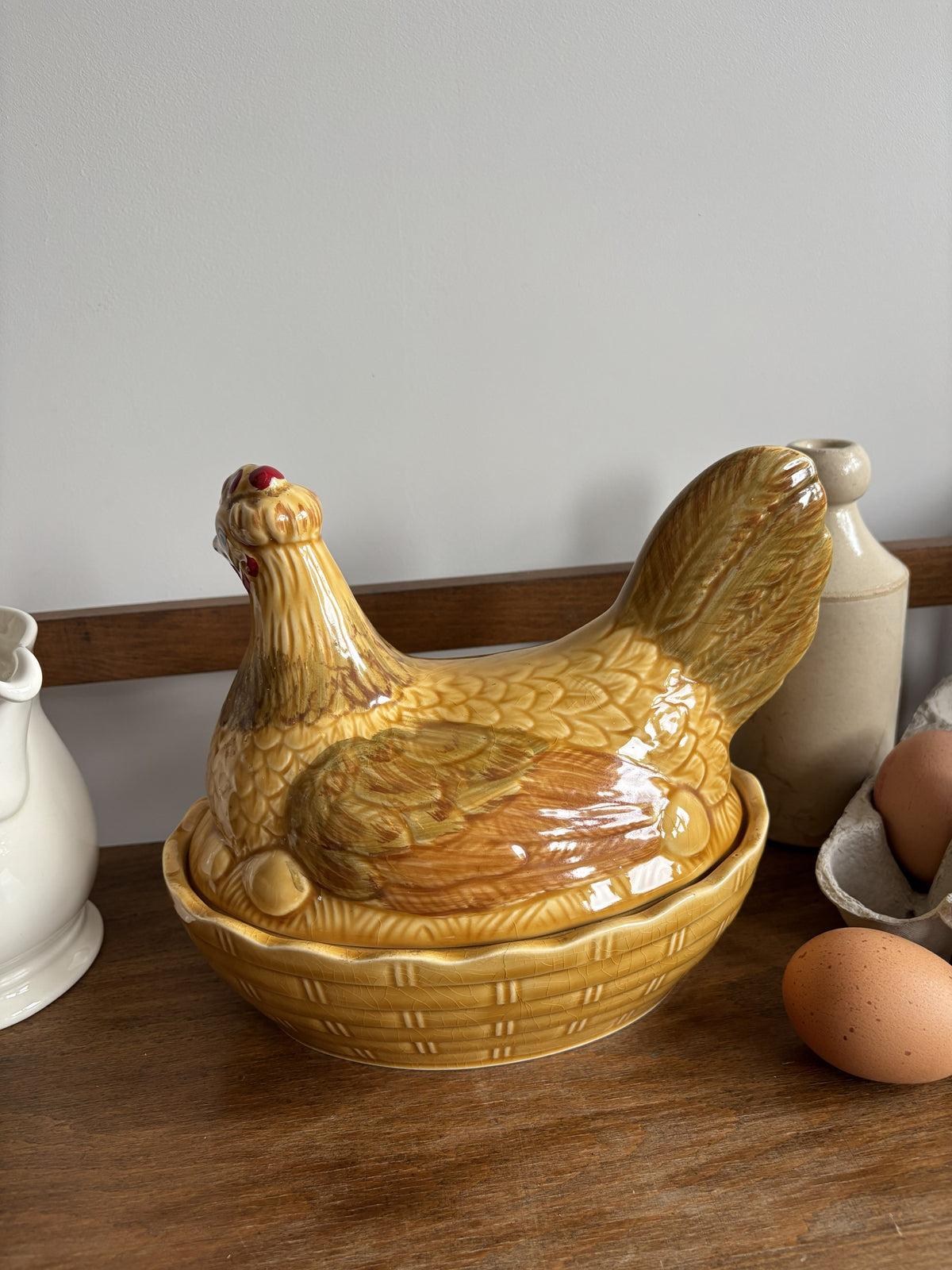 A honey yellow/brown glazed ceramic hen on nest egg keeper.  