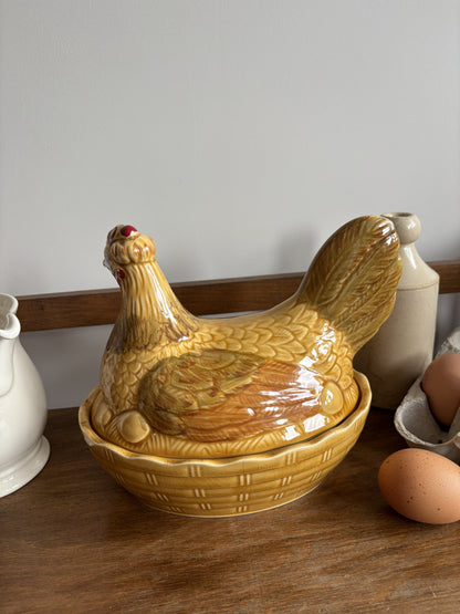 A honey yellow/brown glazed ceramic hen on nest egg keeper.  