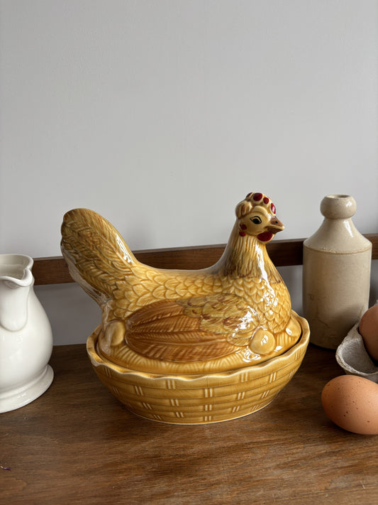 A honey yellow/brown glazed ceramic hen on nest egg keeper.  