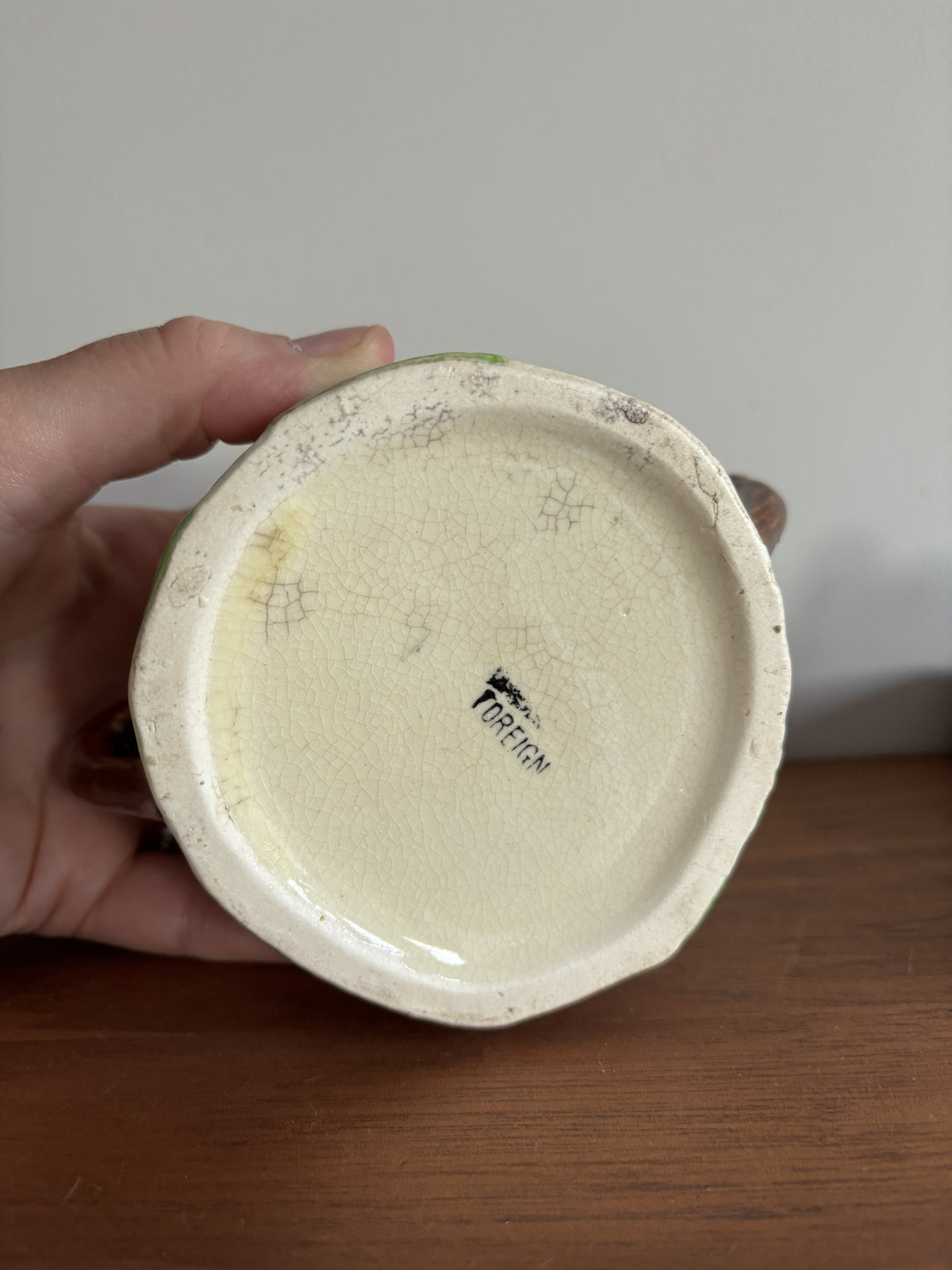 The bottom of a Suvesco ceramic honey pot stamped with the word Foreign.  