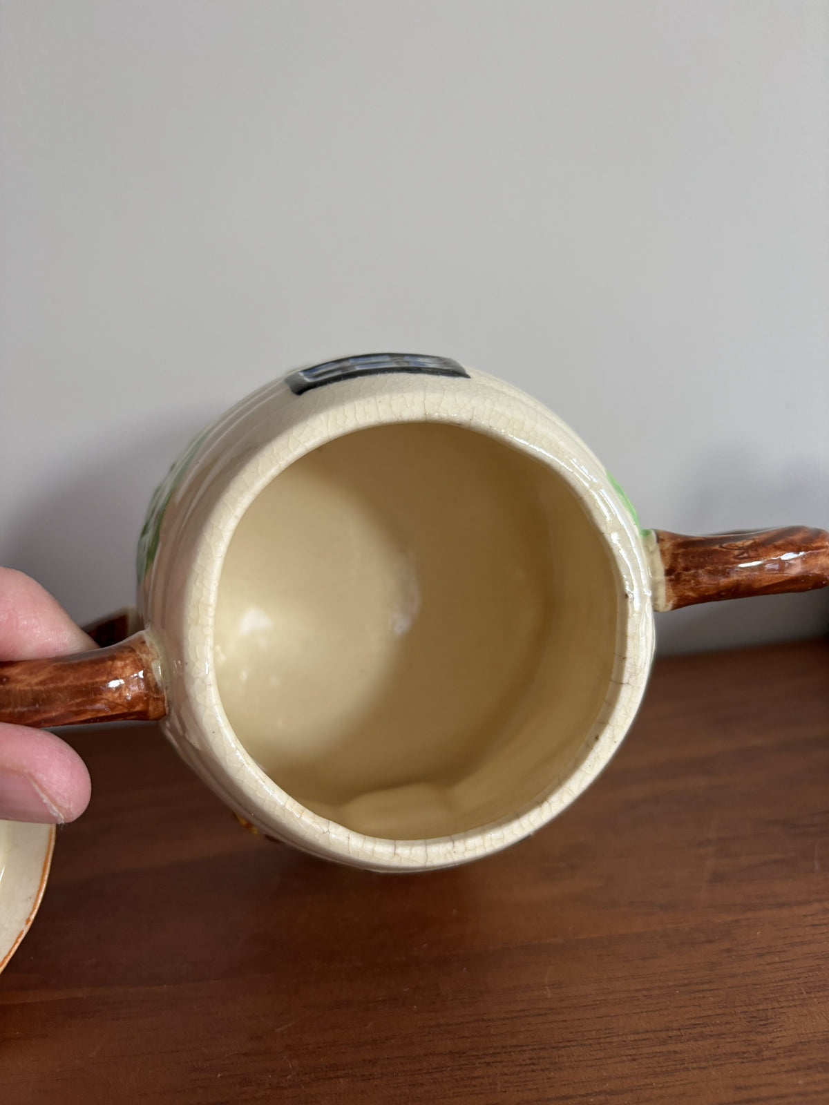 The inside of a Suvesco ceramic honey pot. 
