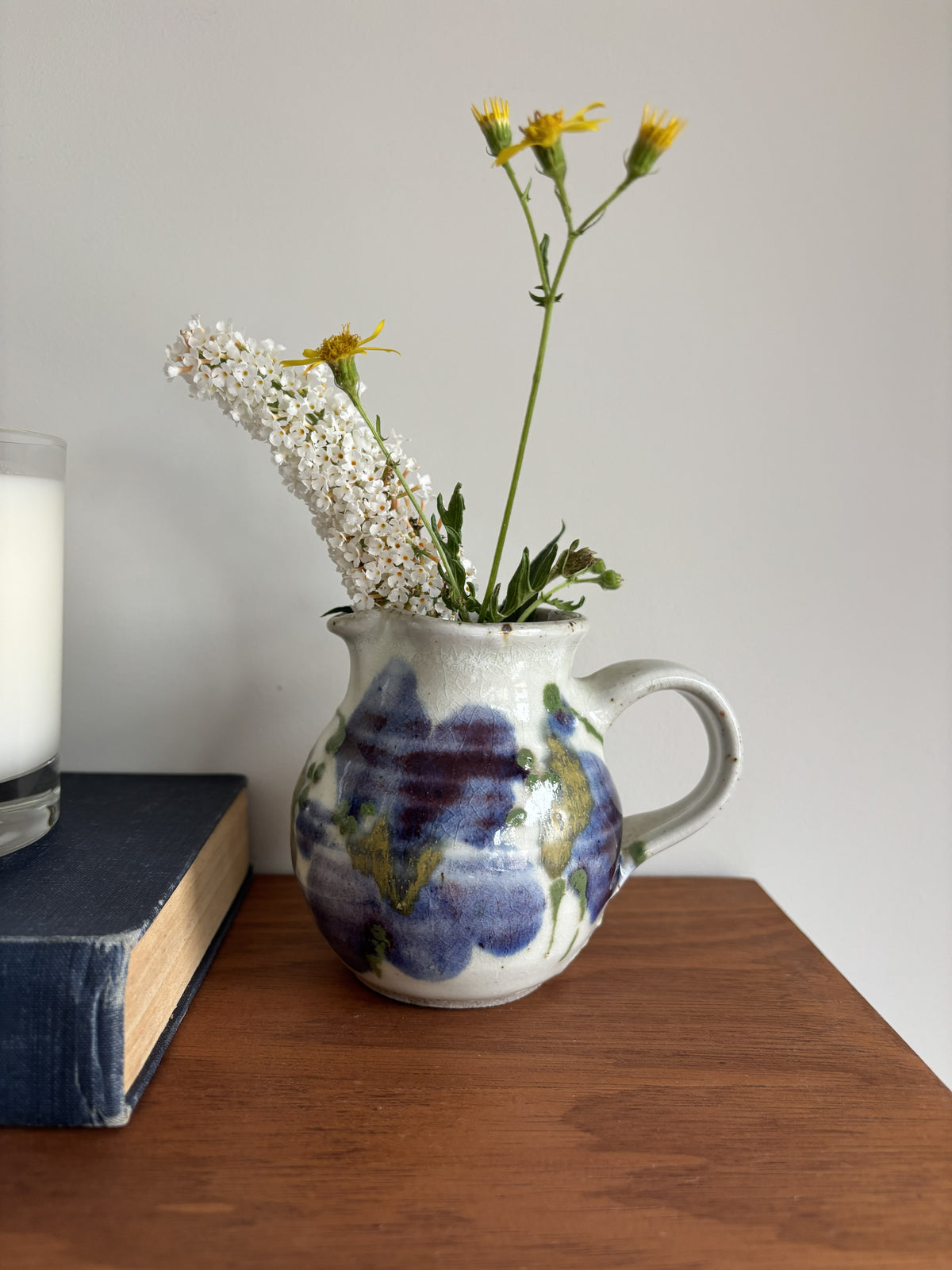 A small blue and white bud vase 