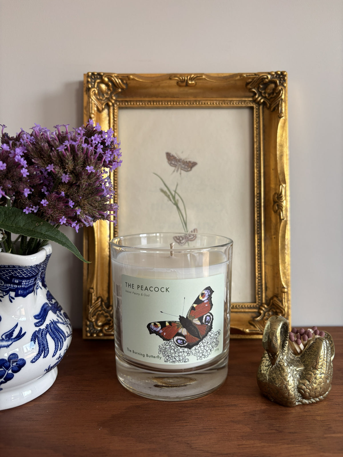 The Peacock Scented Candle in clear glass - Velvet Peony and Oud | The Burning Butterfly